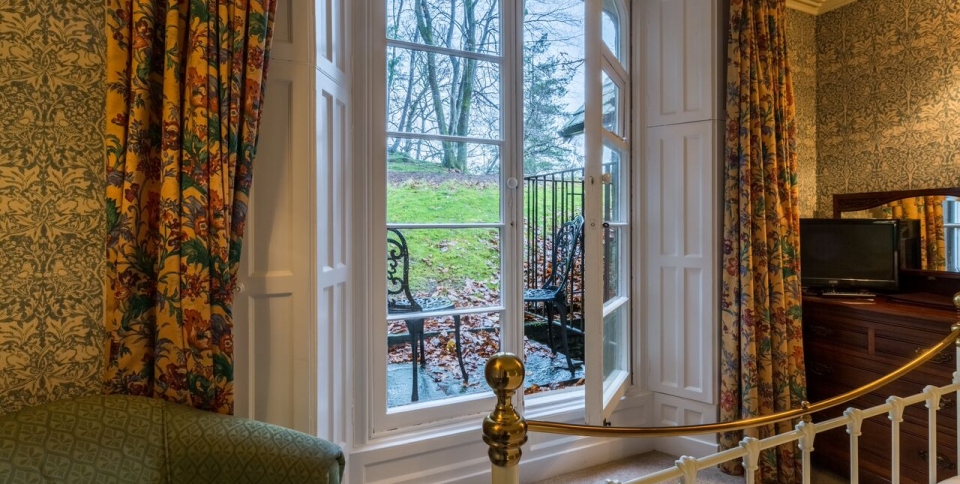 Patio doors onto woodland garden